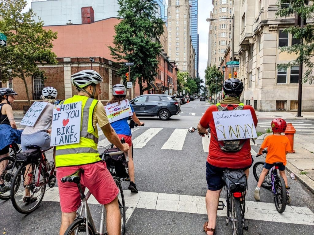 Photo of PBA members on bicycles approaching Spruce St in Philadelphia.